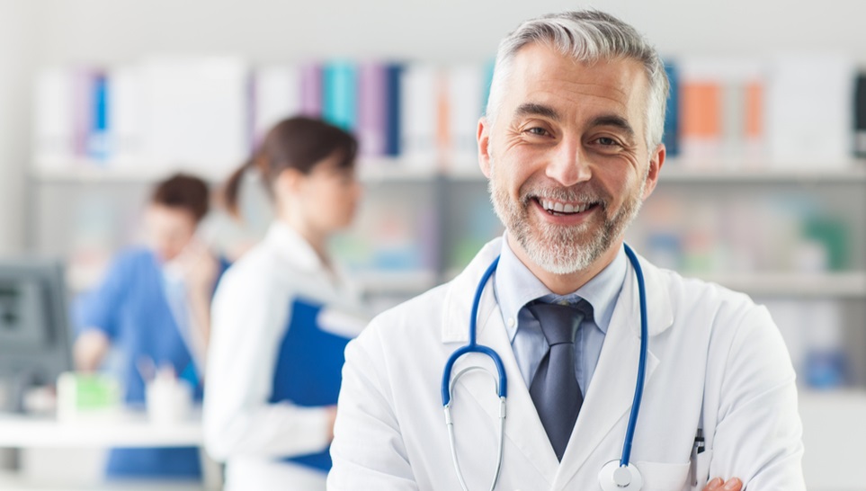 a happy doctor facing up the camera