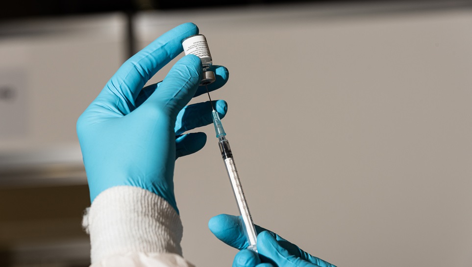 syringe pumping up a zostavax vaccine