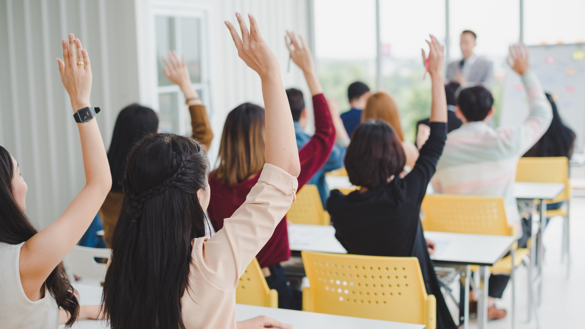 raising their hands to ask questions