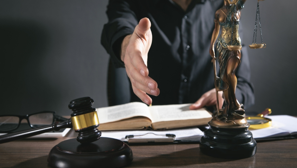 a lawyer offering his hand to help