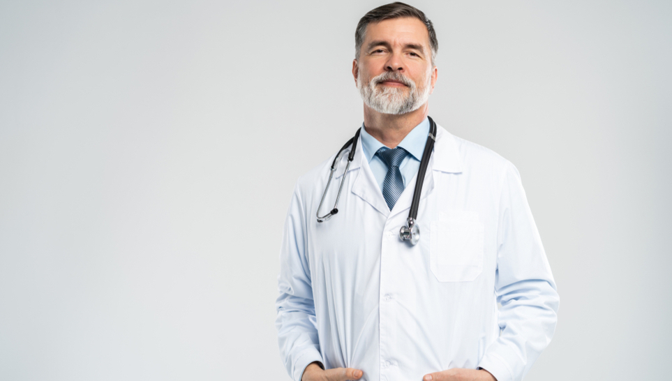 doctor standing in a gray background