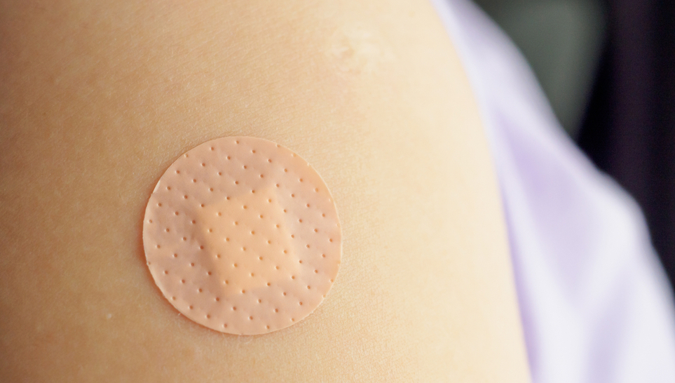 patch on a shoulder after a vaccine