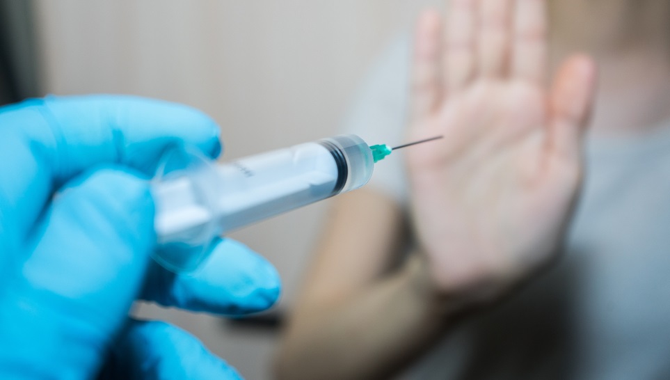 hand saying no to a chickenpox vaccine