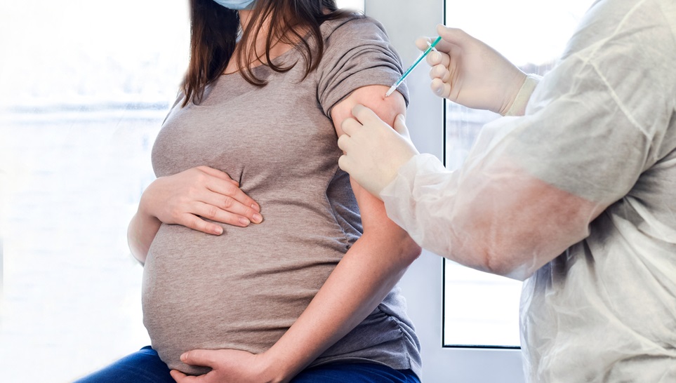 a pregnant woman getting a tdap vaccine