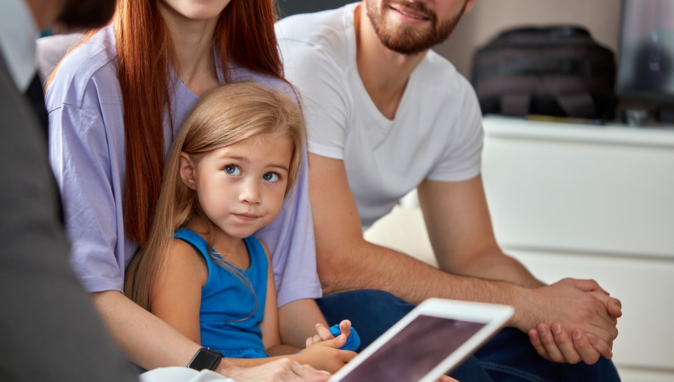 family talking to a lawyer about a vaccine injury of their daughter