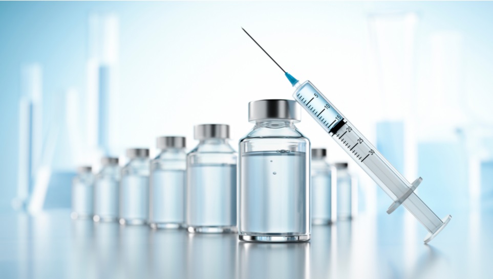 vaccine bottles and a syringe