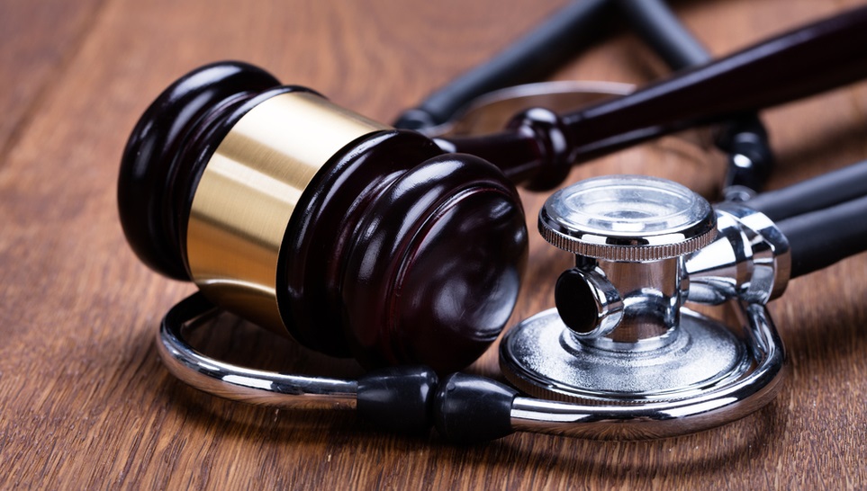 a gavel and a medical stethoscope