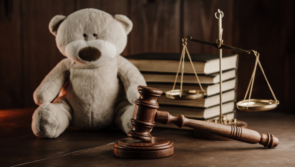 a teddy bear and law equipment