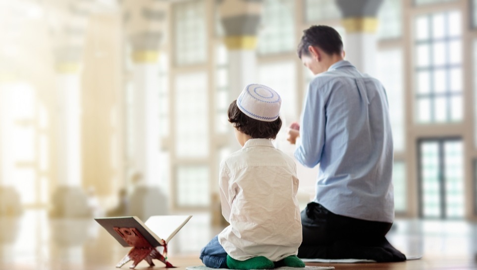 man and a child praying