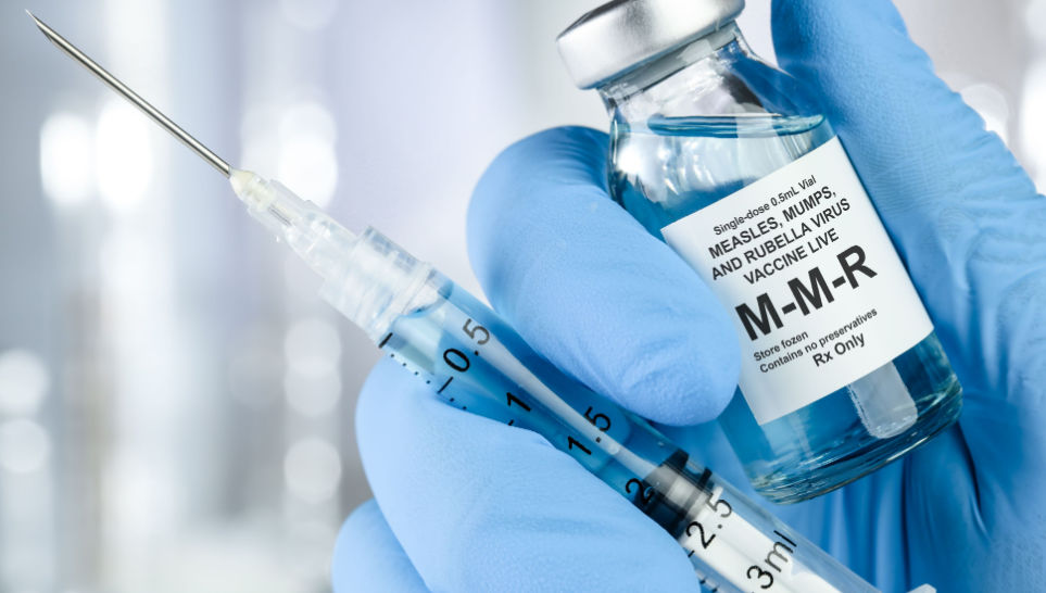 syringe and small vial with mmr vaccine