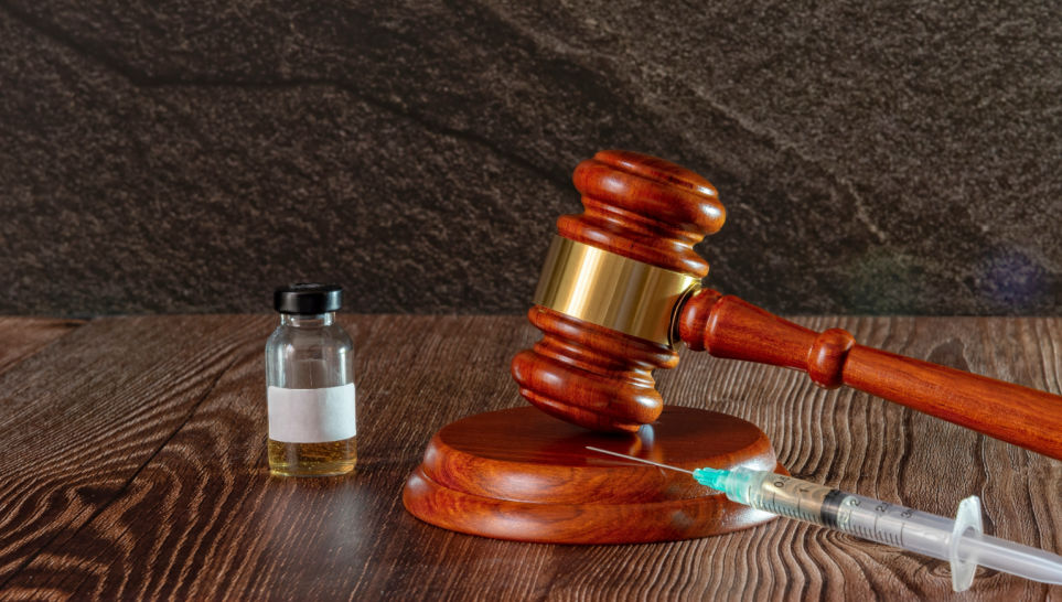 judge hammer syringe and hepatitis b vaccine bottle