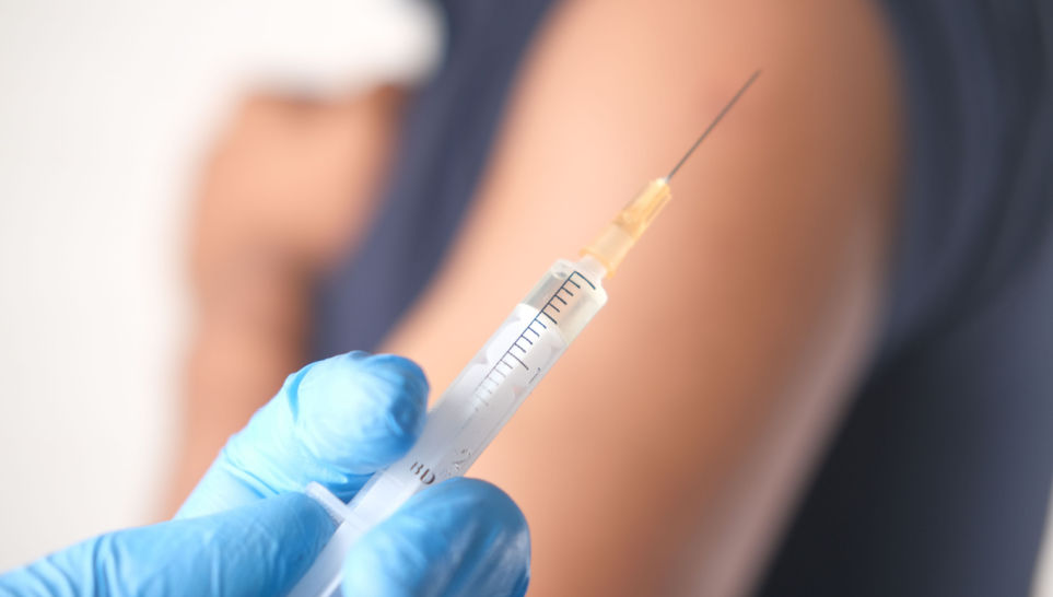 doctor hand in medical gloves holding syringe