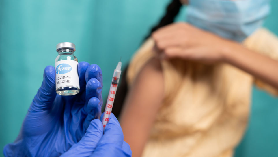 patient taking pfizer vaccine at hospital