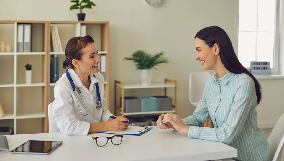 young woman consulting doctor before getting twinrix vaccine