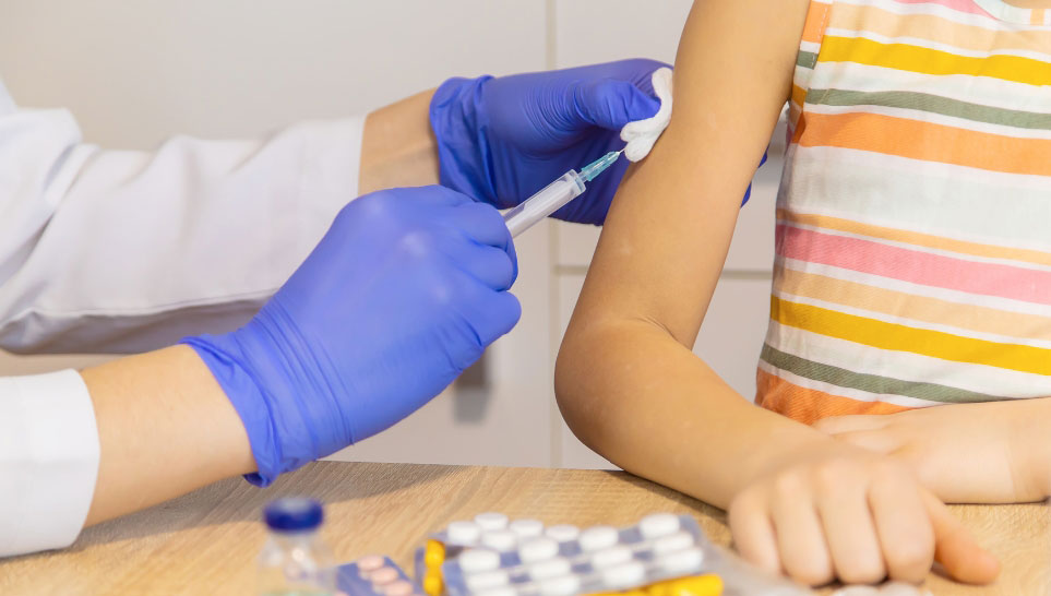 doctor giving flucelvax vaccine to a kid