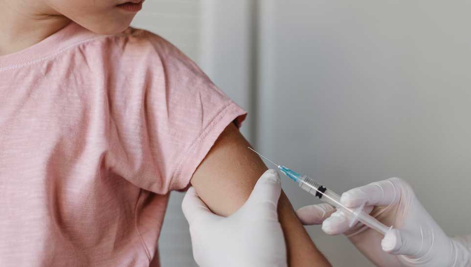 doctor giving vaccine to kid