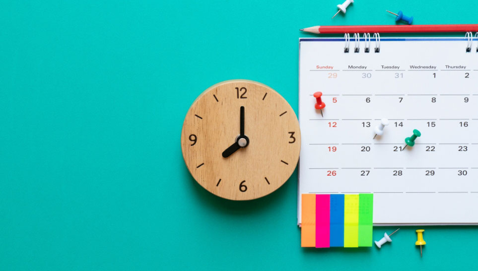 calendar pencil pins and clock on green background