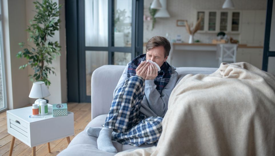 man having sneeze and cough after receiving pneumonia shot