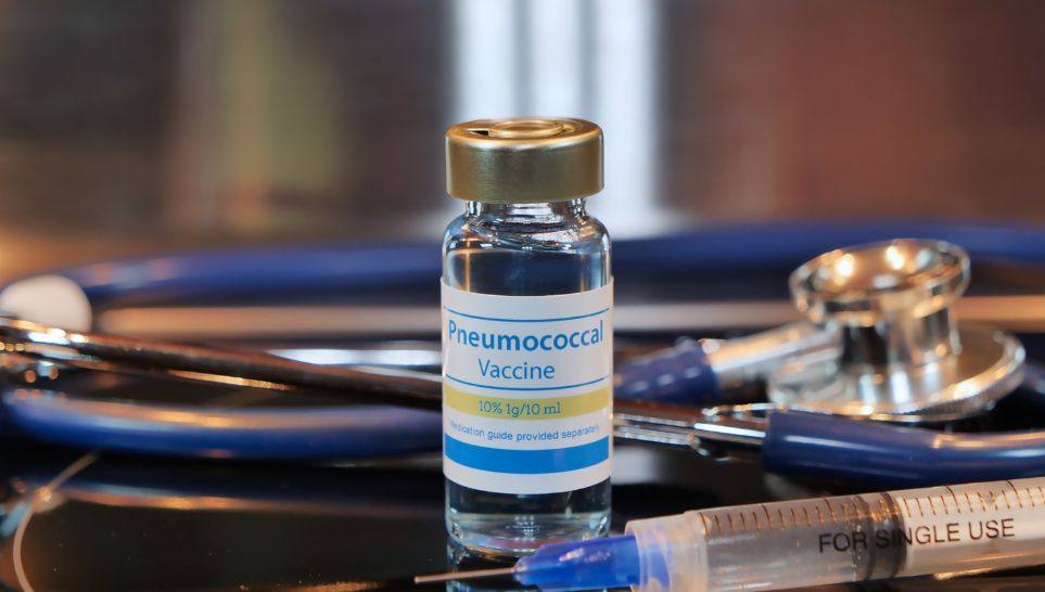 vial of pneumococcal vaccine on a stainless steel background